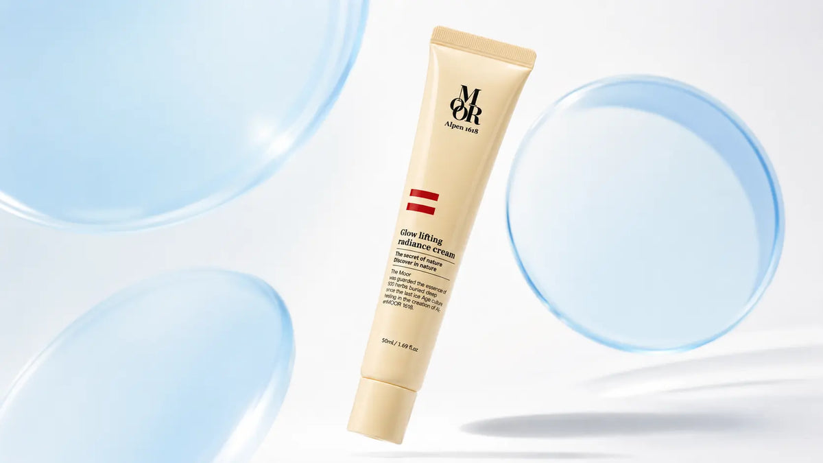 Alpen MOOR 1618 Glow Lifting Radiance Cream floating among translucent blue circular forms