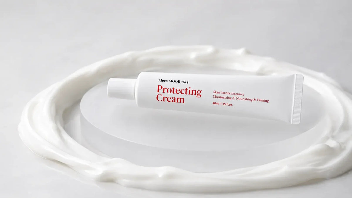 Protecting Cream tube resting on a swirl of white cream showing its rich, emollient texture