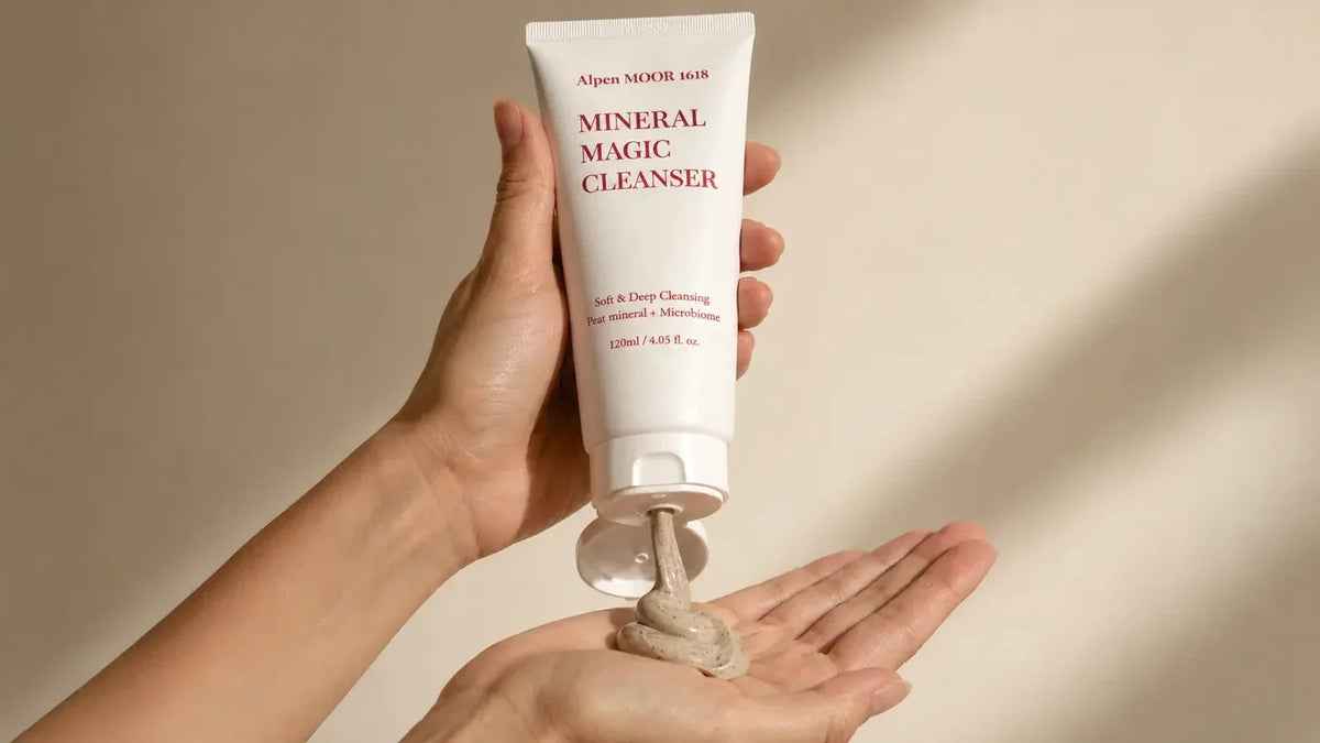 Mineral Magic Cleanser being squeezed from the tube into an open palm