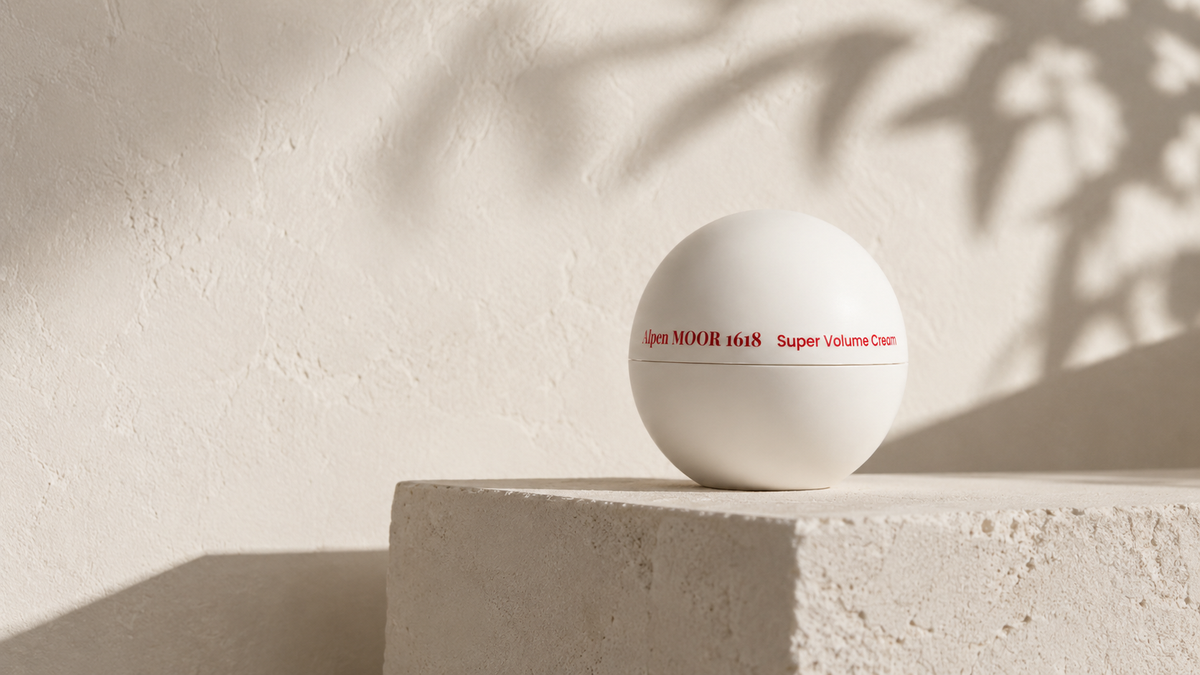 Super Volume Cream beside spaced stones representing a gradual retinoid routine