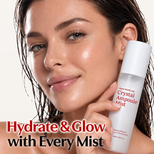 Woman holding the Crystal Ampoule Mist bottle beside her cheek, under the words Hydrate and Glow with Every Mist.